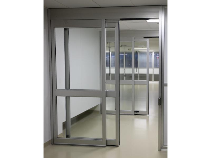 Sliding glass door in a modular cleanroom designed by Gerbig Cleanrooms.