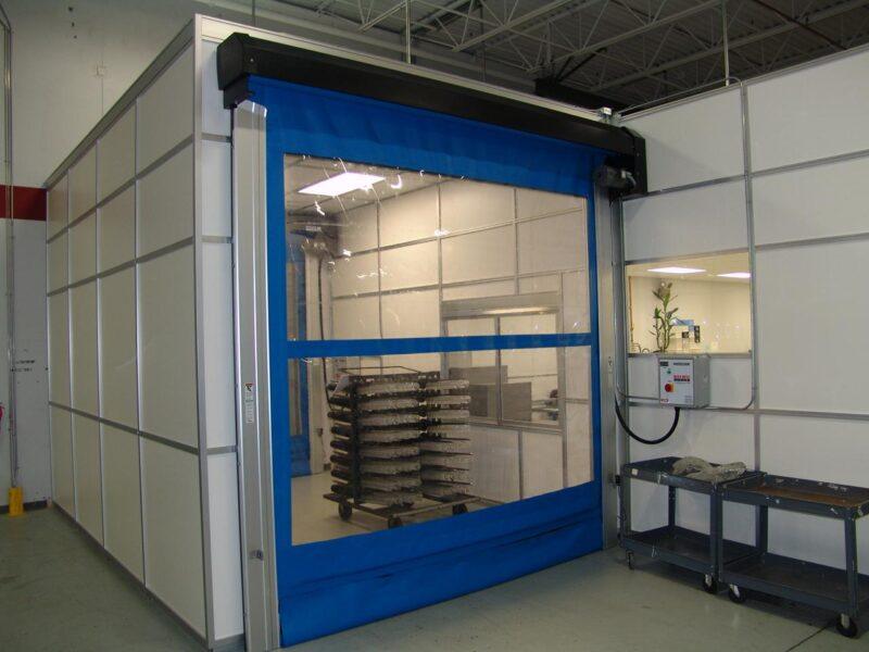 Modular cleanroom by Gerbig Cleanrooms, featuring a blue softwall door.